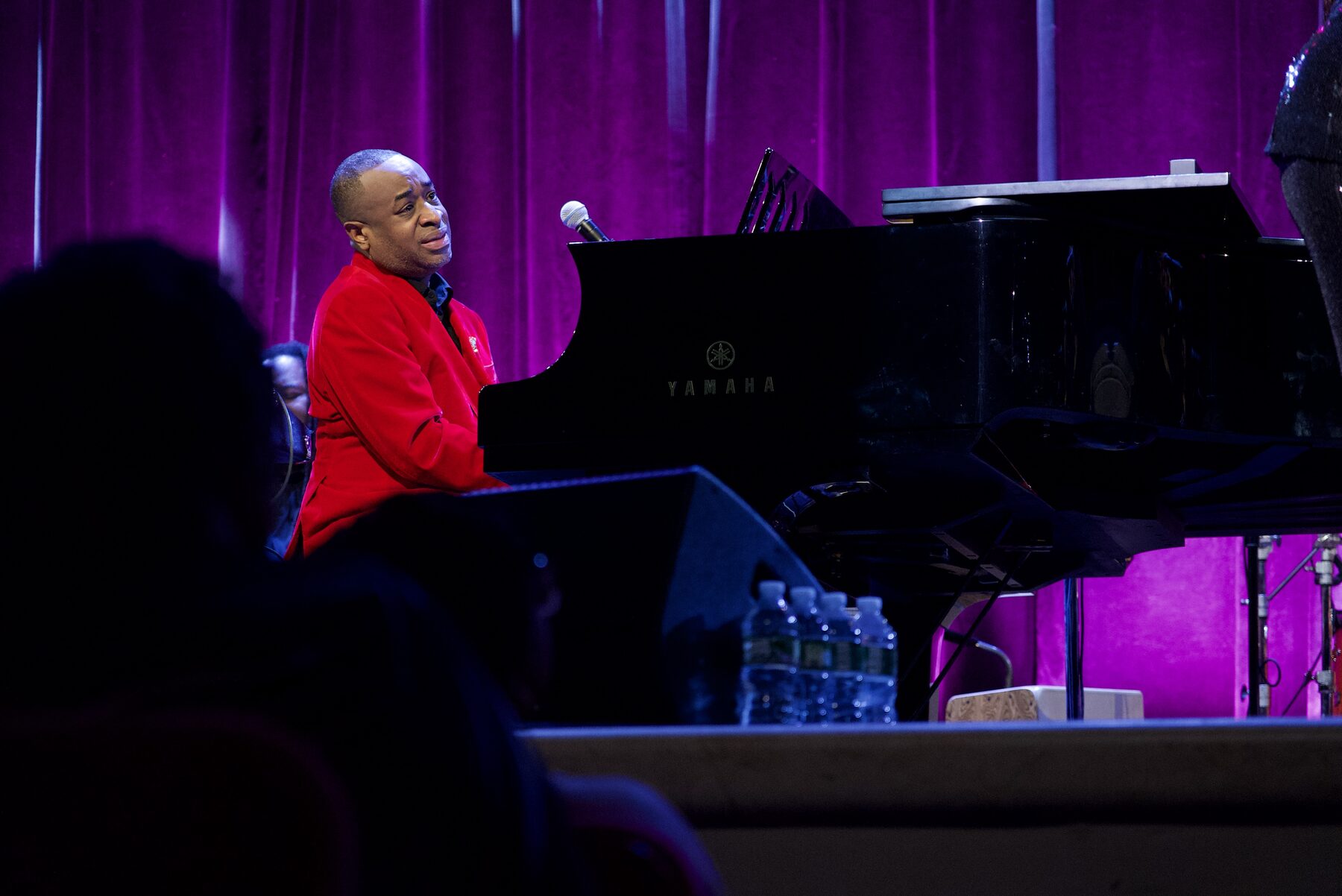 Damien Sneed performing at the grand piano