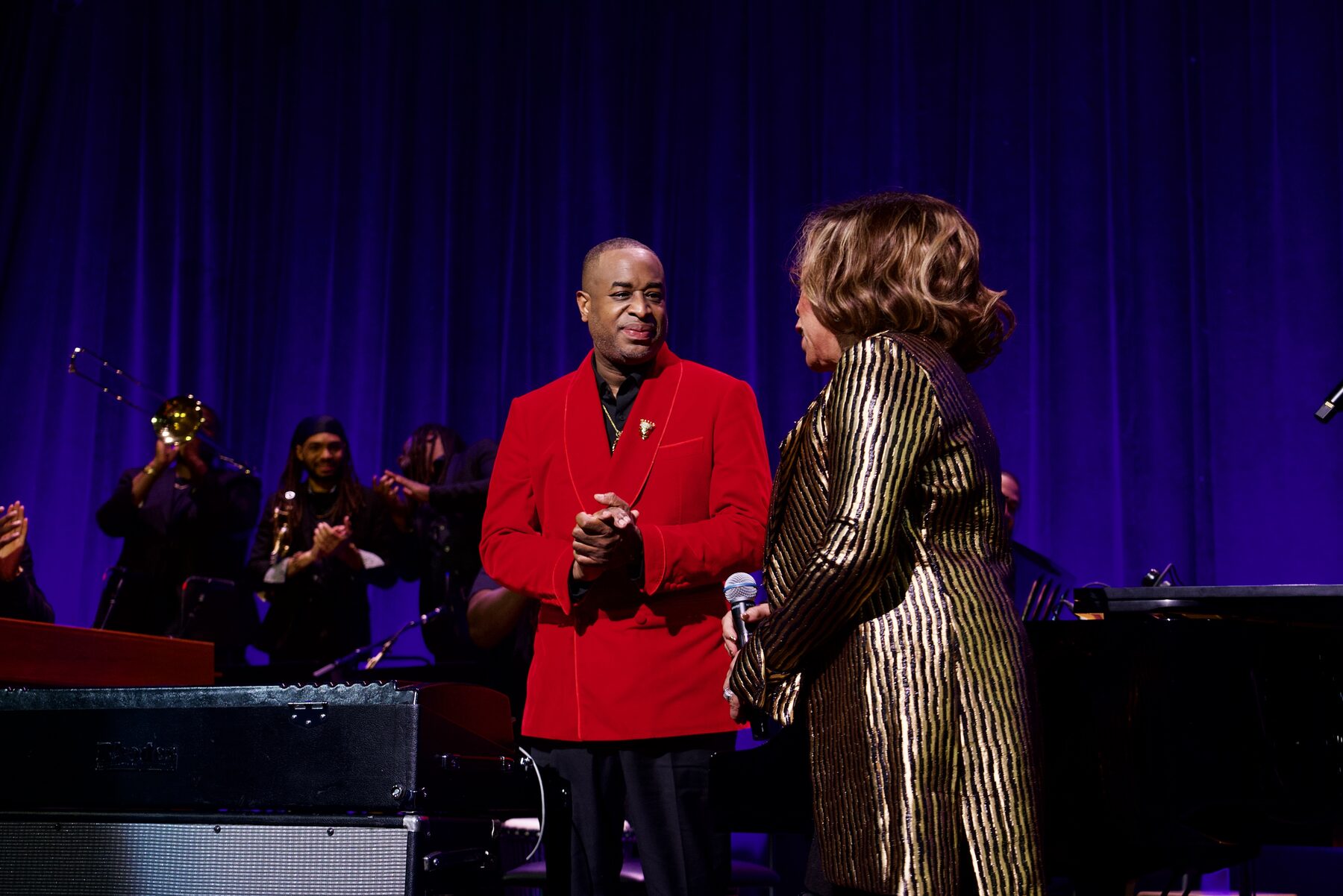 Damien Sneed greeting Elbernita Twinkie Clark on stage
